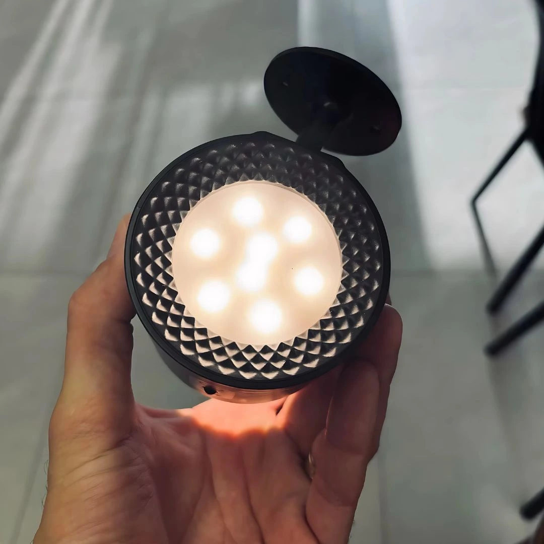 Dual-sided rechargeable wall light showing spotlight and halo modes