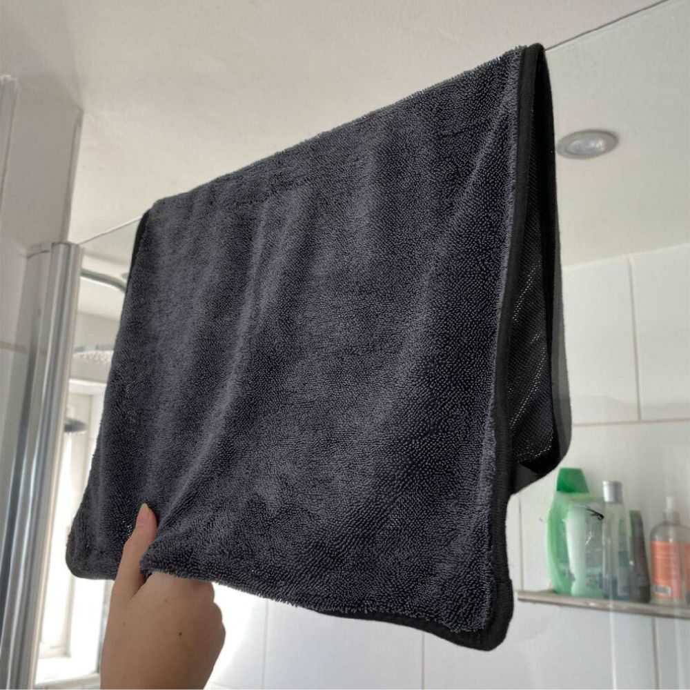 Super absorbent shower towel removing streaks from bathroom tiles
