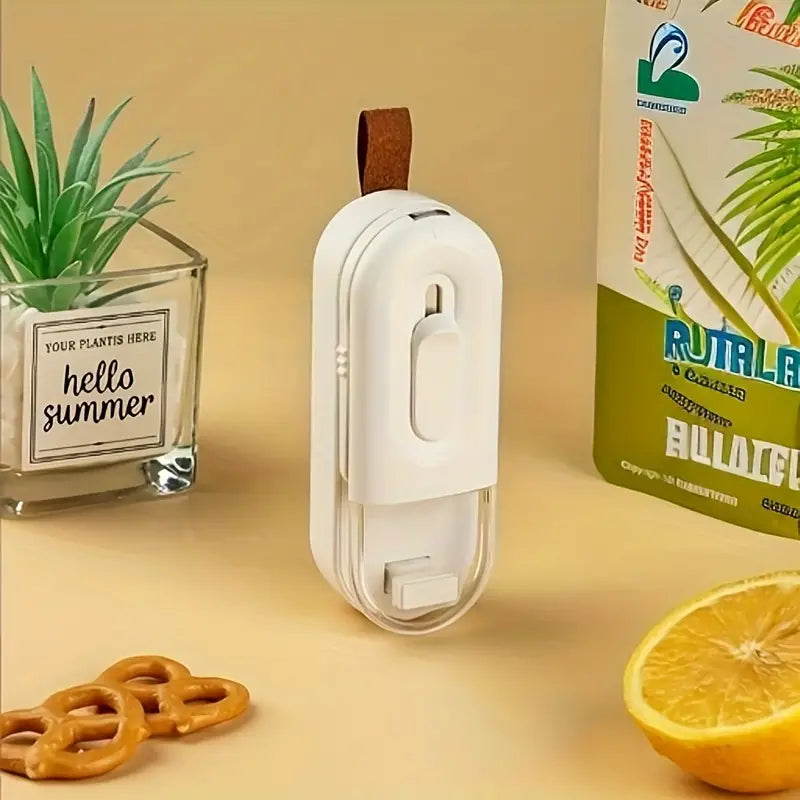 Compact snack sealer in use on kitchen counter


