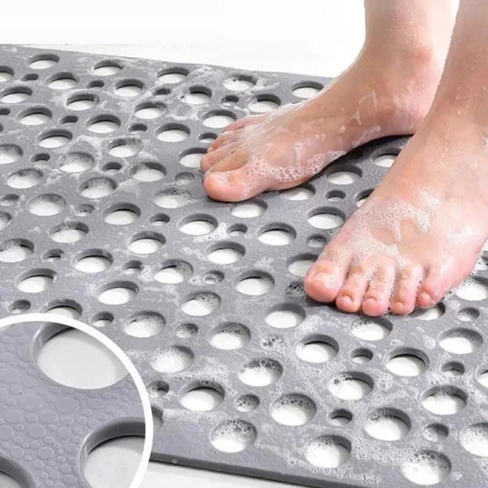 Anti slip shower mat for wet surfaces